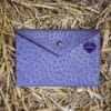 Epona purple ostrich leather clutch bag