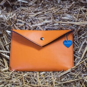 Epona orange leather clutch bag